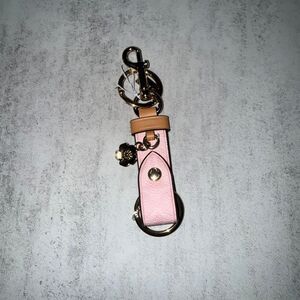 Coach powder pink trigger snap keychain with flower charm